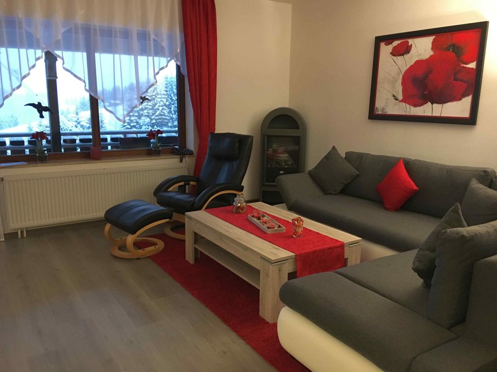 Seating area with a fireplace in the living room on the ground floor